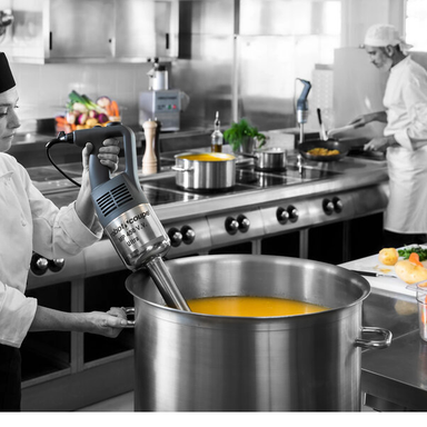 This image shows Robot Coupe MP450 Turbo in use in a commercial kitchen